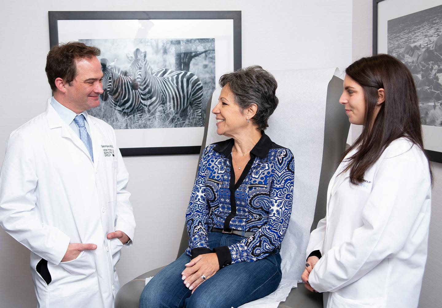 Doctors speaking to woman