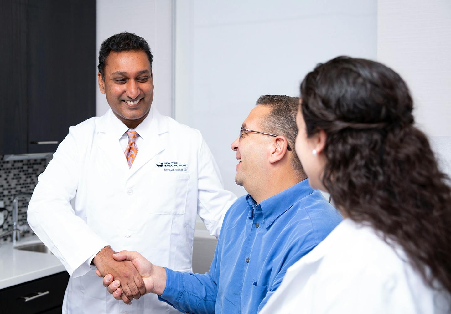 Man shaking doctor's hand