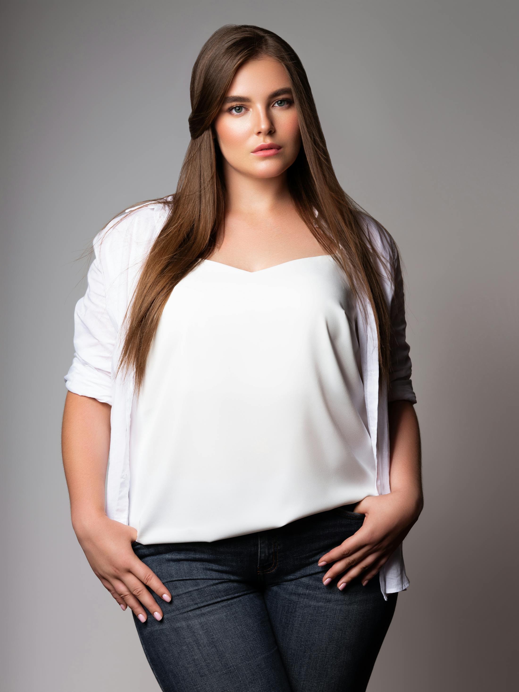 Woman with brown hair and white shirt