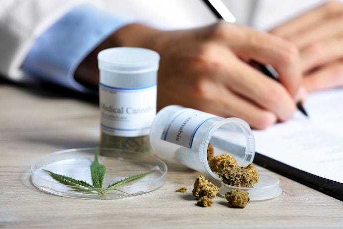 Medicinal Cannabis with doctor writing a script
