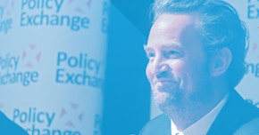 Matthew Perry smiling at Policy Exchange for Drug Courts