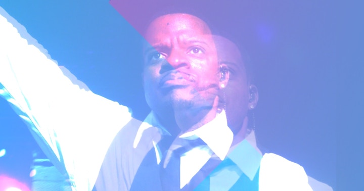 Ricky Bell and Addiction Ricky Bell with his hand in the air