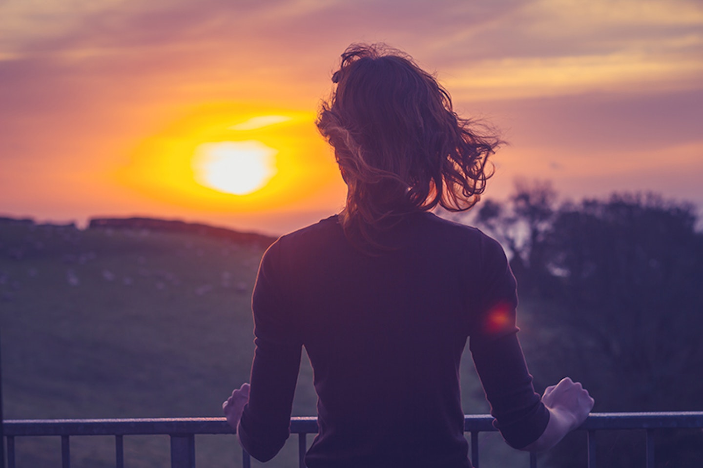 Young Woman Admiring the Sunset