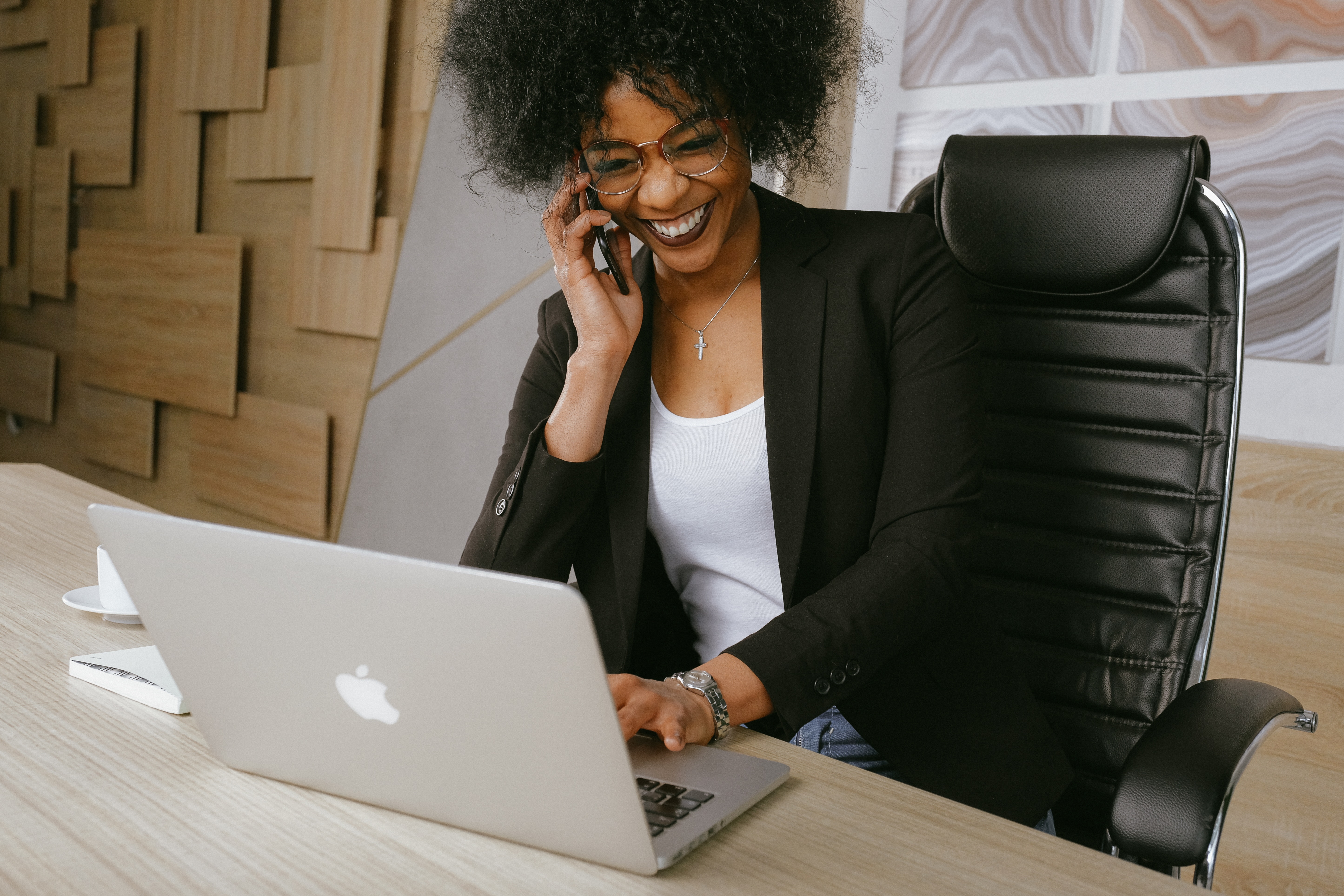 business woman on phone and laptop