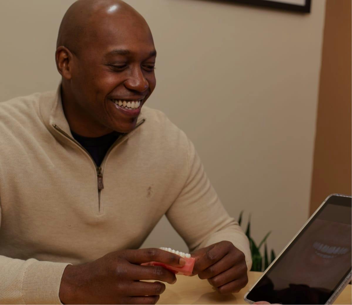 Male patient looking at image of a perfect smile