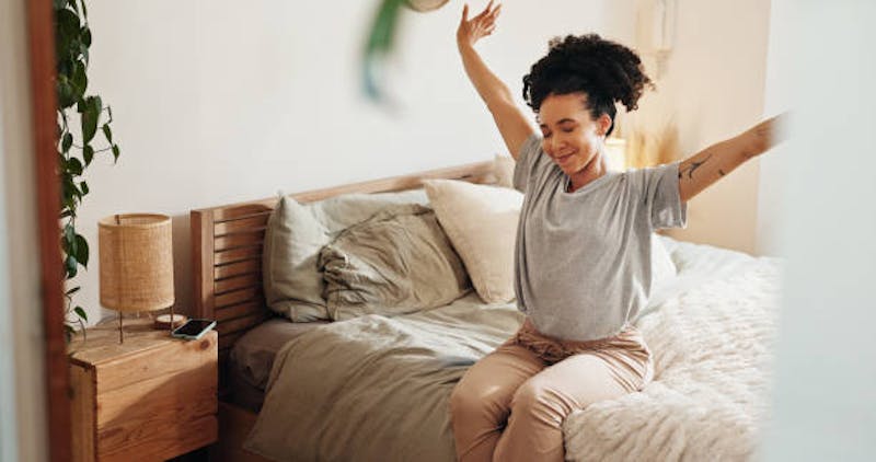 Woman Waking Up From a Good Night Sleep