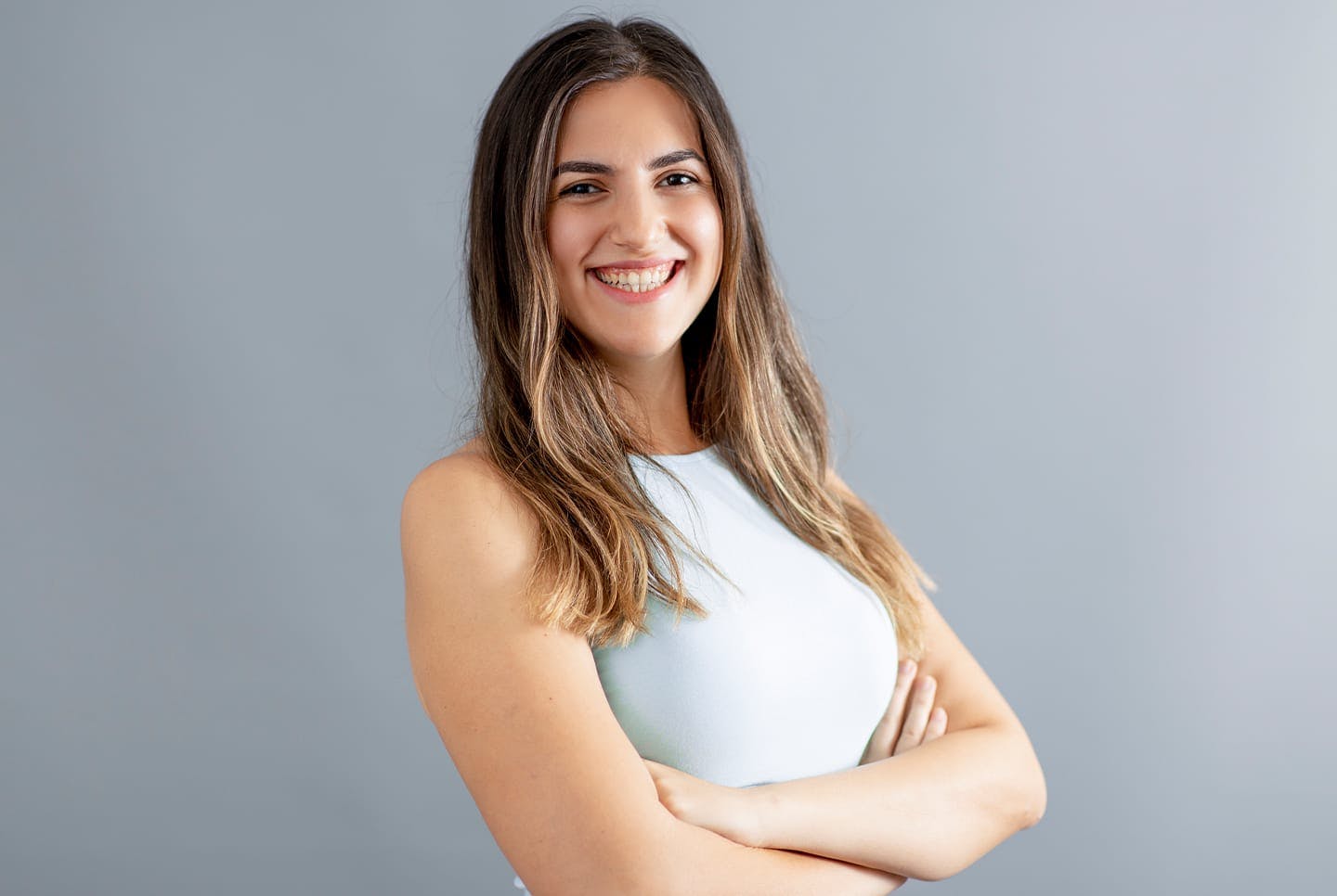 woman smiling with crossed arms