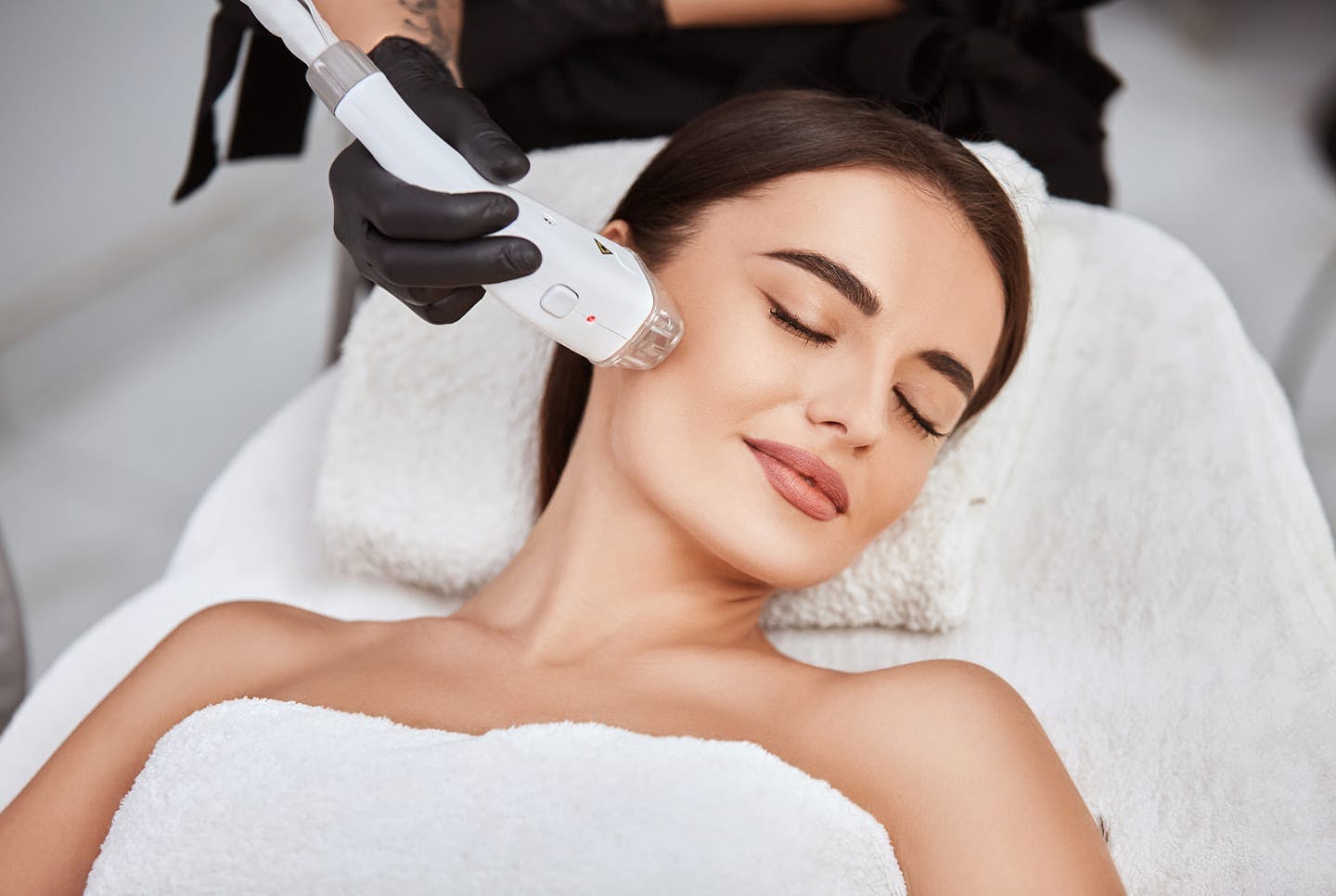 woman receiving laser treatment