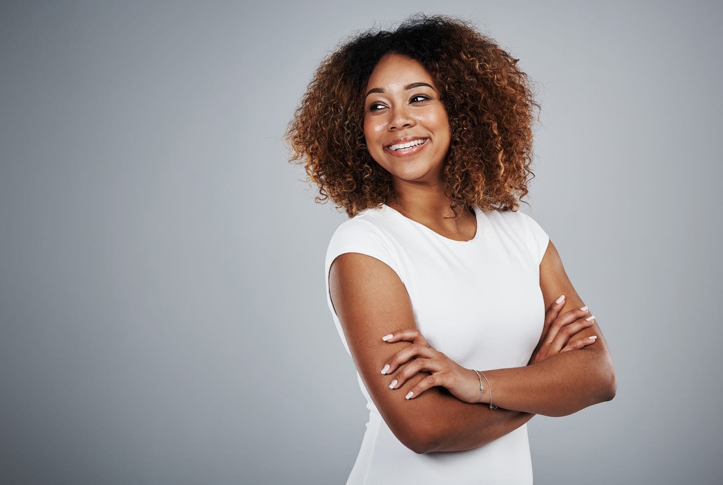 woman smiling with crossed arms