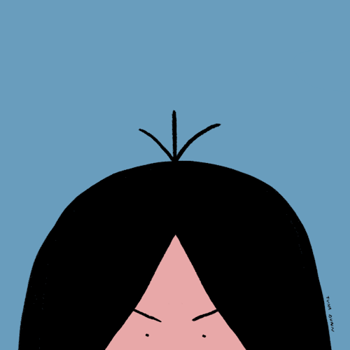 a hand smooths down a tuft of hair on a persons head