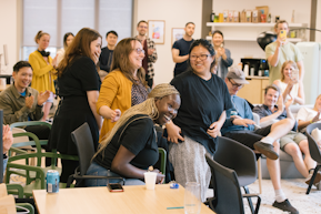 A team of really happy hackathon winners laughing in disbelief