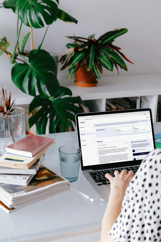 A person is using their laptop to access their user portal on the Calmly website