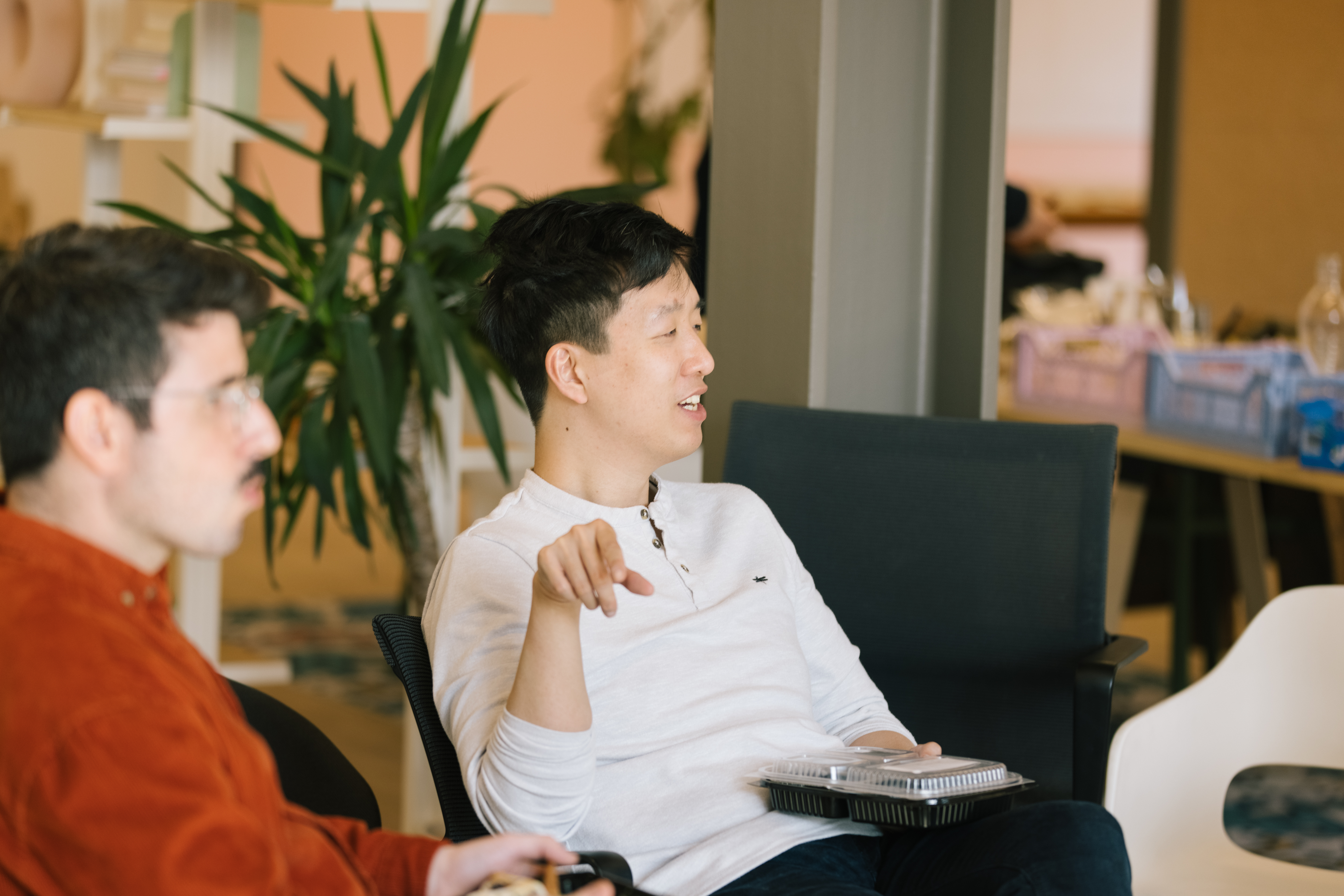 Wing a Product Manager is talking with colleagues