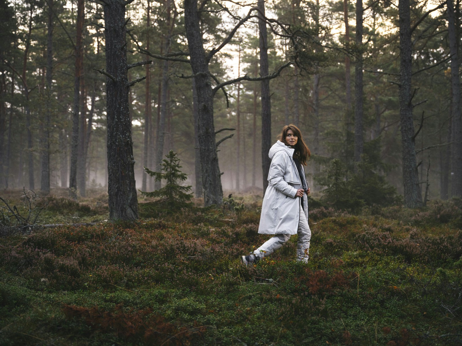 A women running in the woods