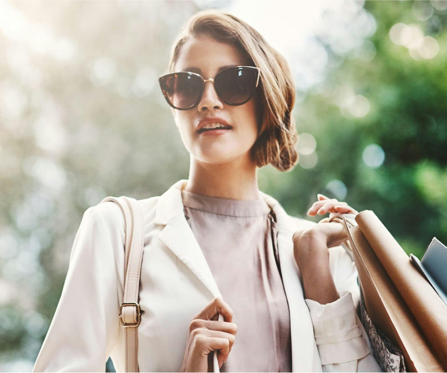 Beautiful young woman in sun glasses.