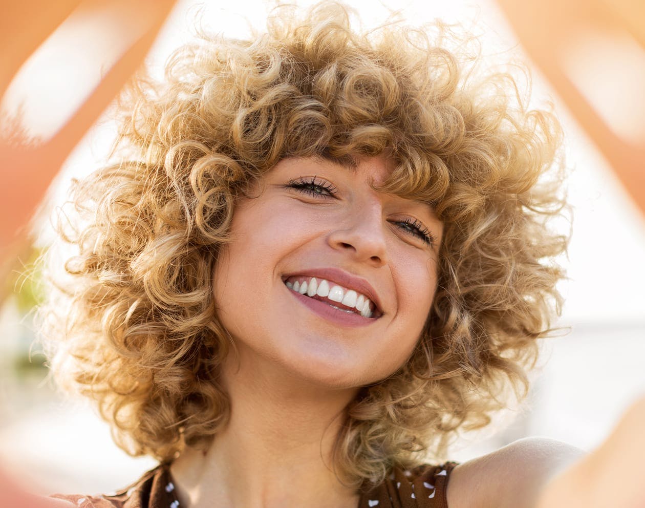 Smiling woman with curly hair