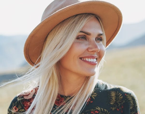blonde woman wearing a straw hat