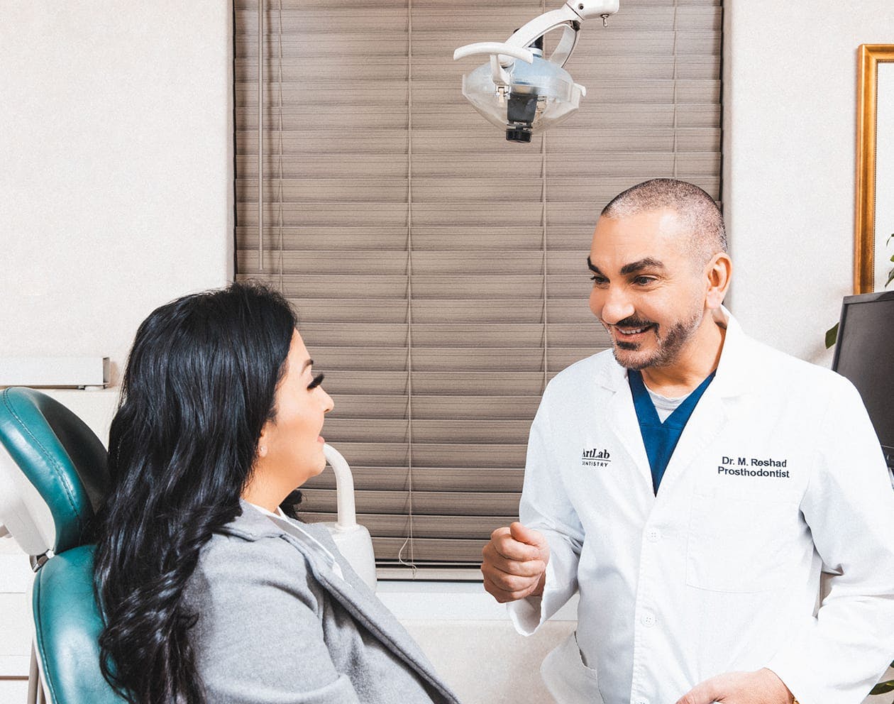 Dr. Reshad talking with a patient