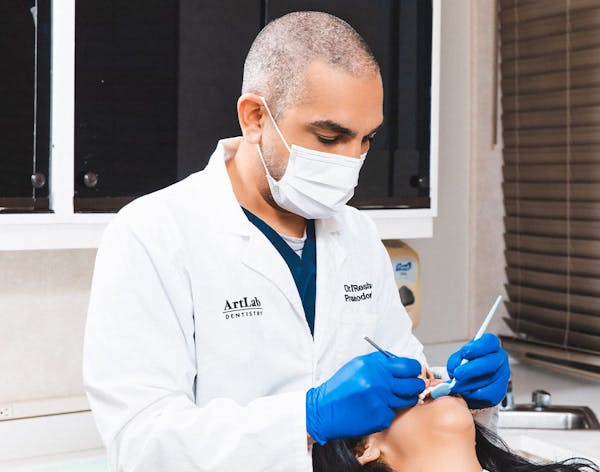 Dr. Reshad doing a procedure on a patient
