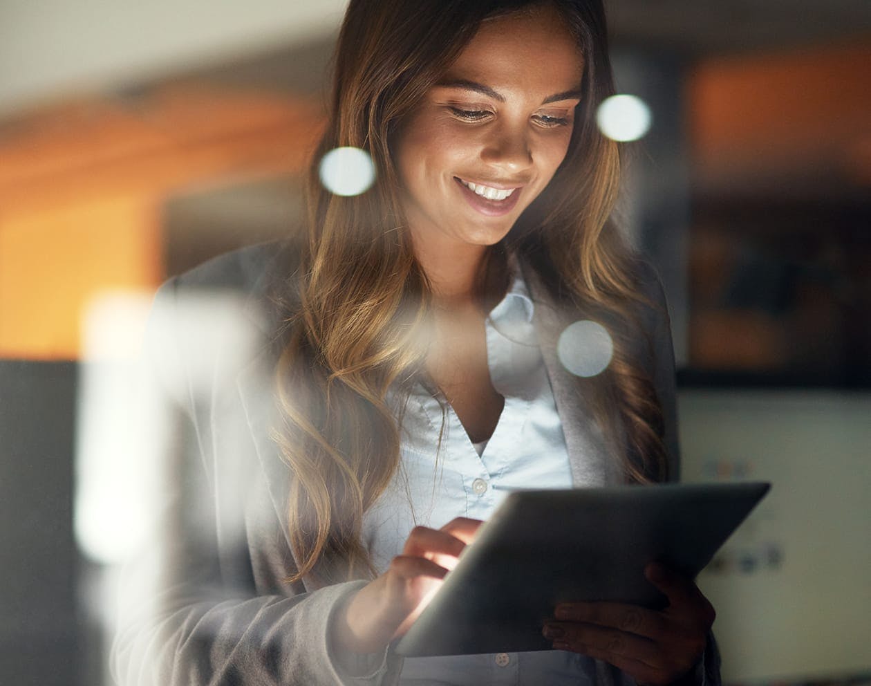a brunette woman on her iPad.