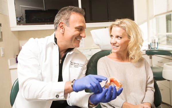 Dr.Maddahi with dental patient