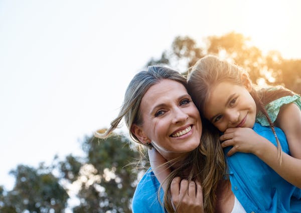 woman and child in the sun