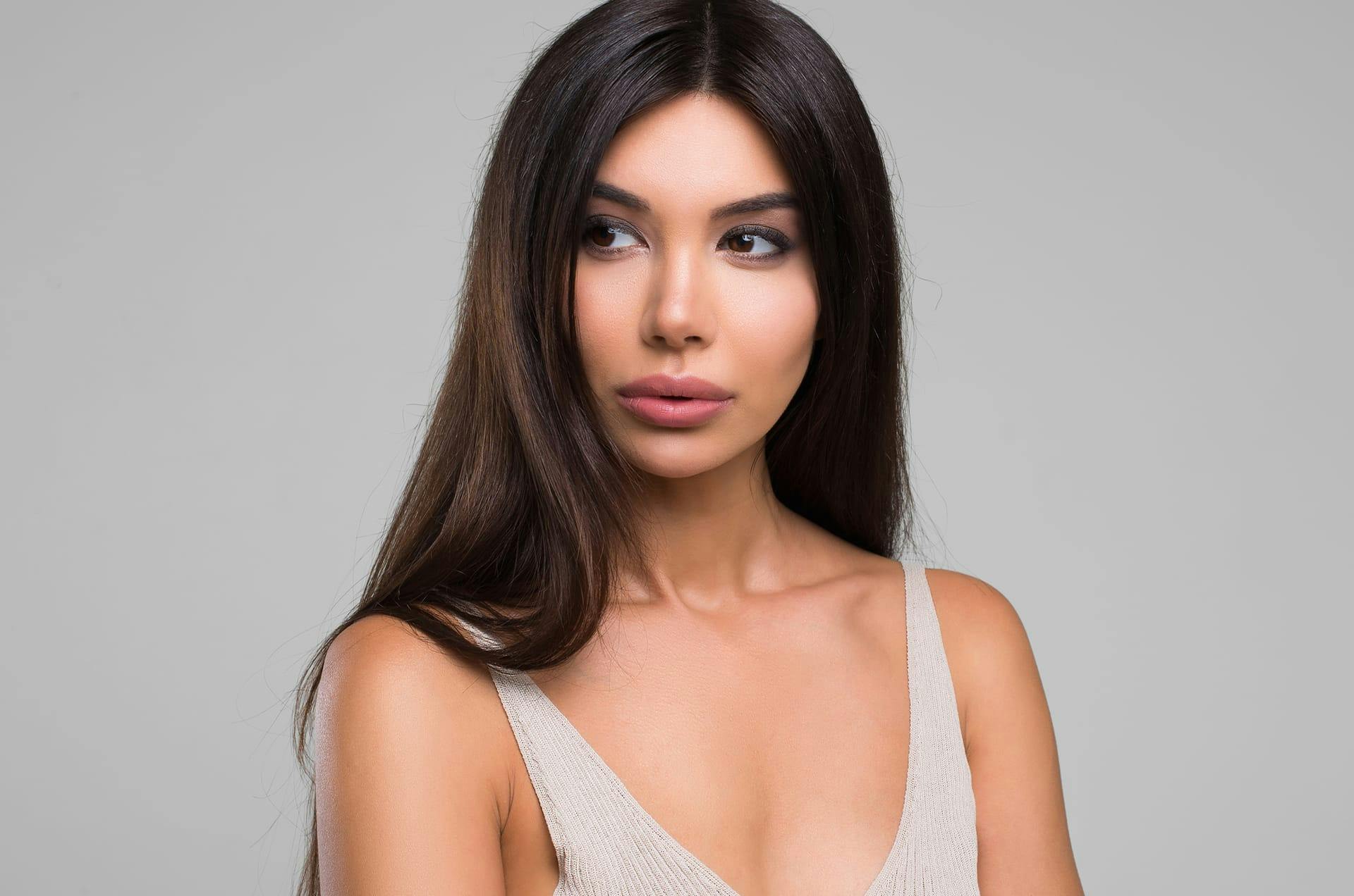 Black-haired woman looking to the side