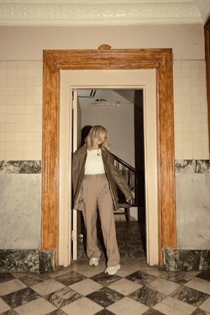 Tiffany under a doorway, smiling