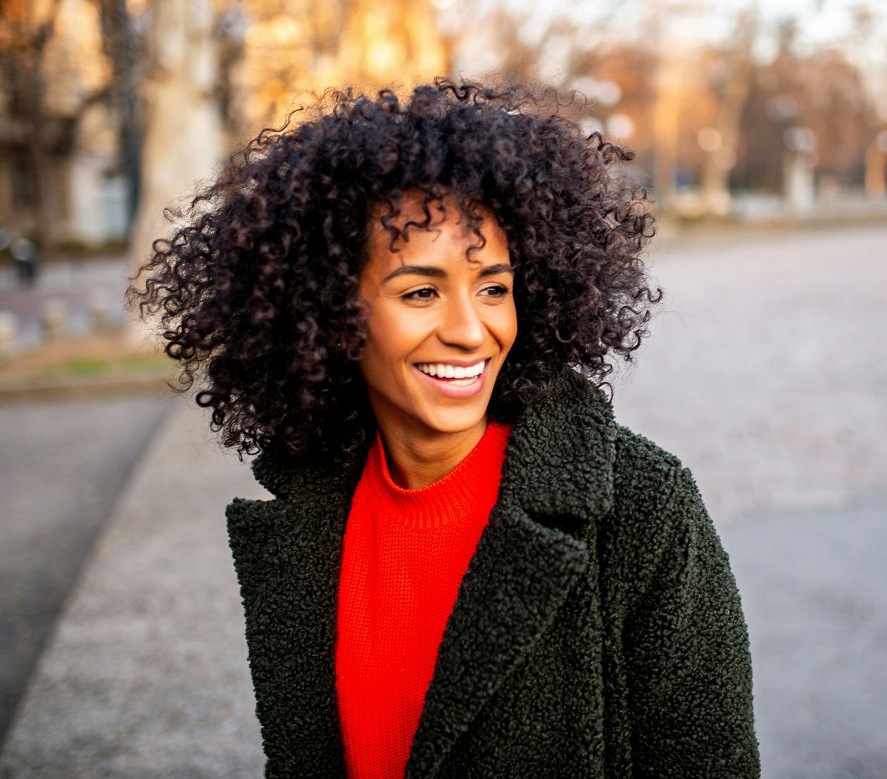 beautiful curly-haired woman smiling