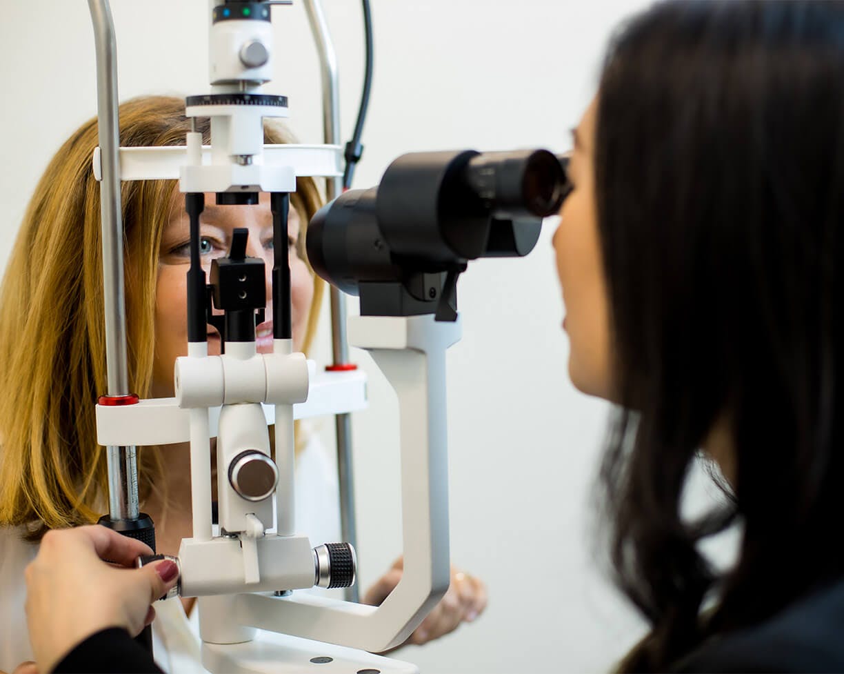 patient looking through an eye tool