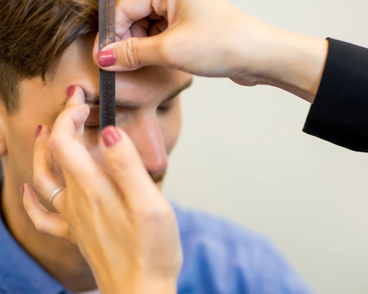 man having his eye measured