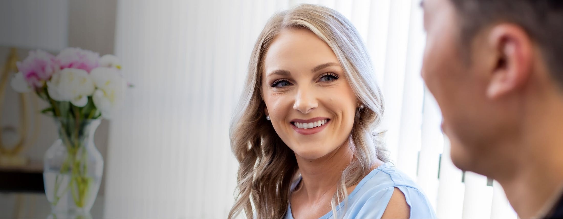 close up of blonde model smiling