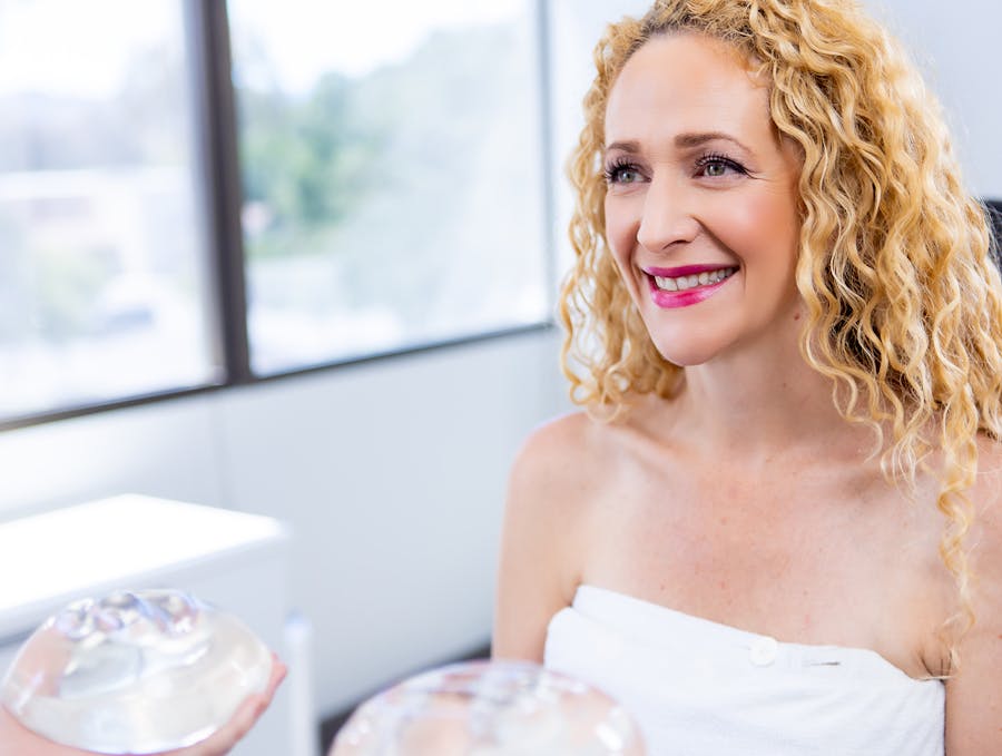 Woman preparing for breast augmentation procedure