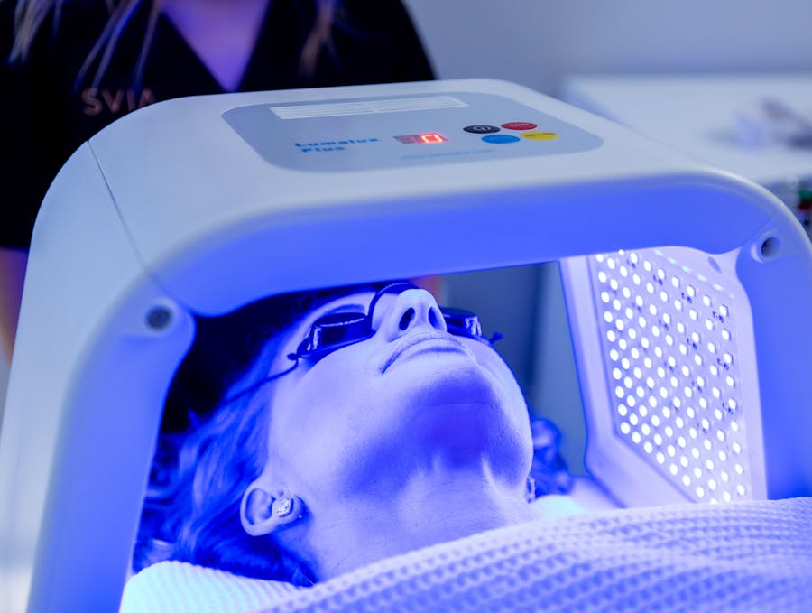 Woman receiving facial treatment