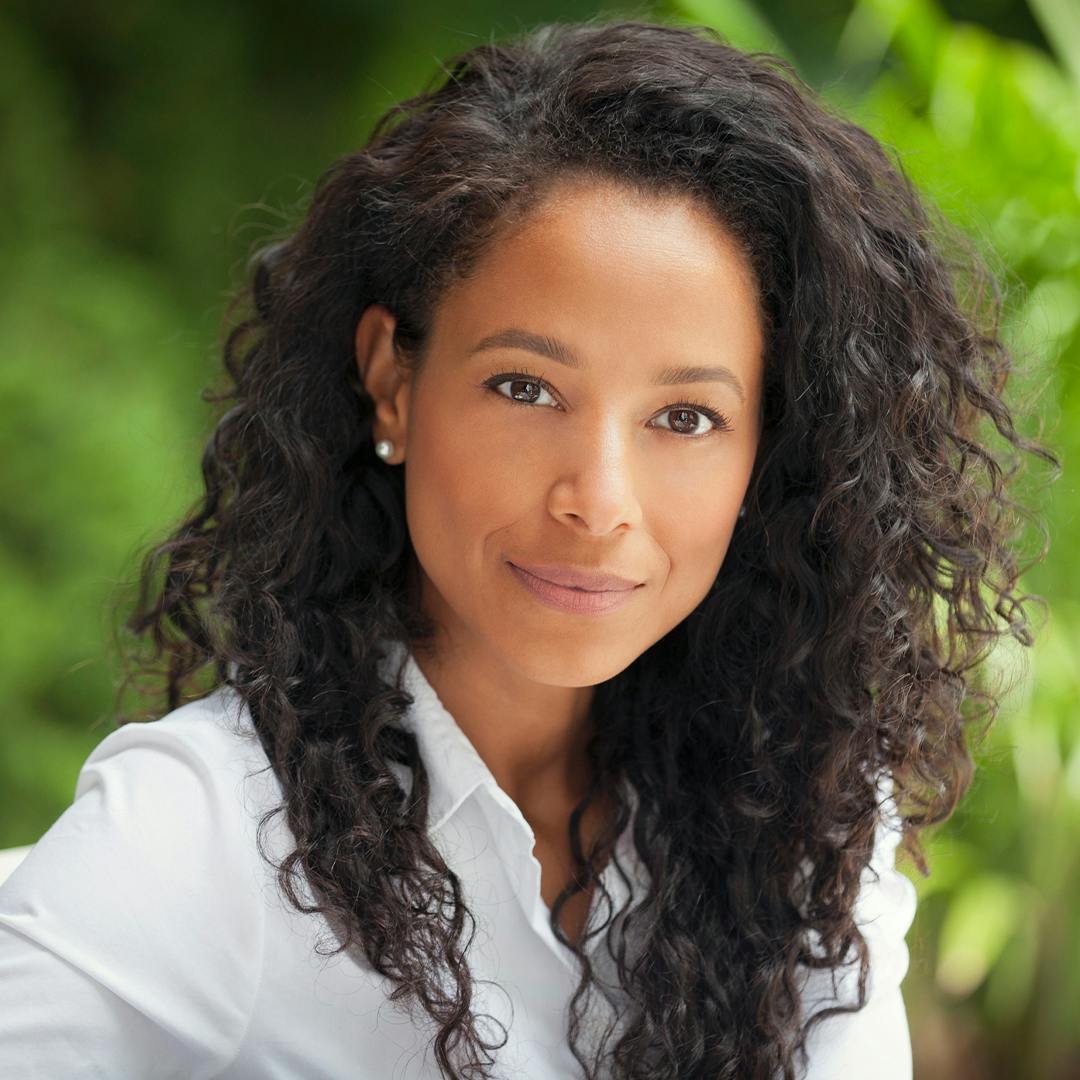 Woman with dark curly hair