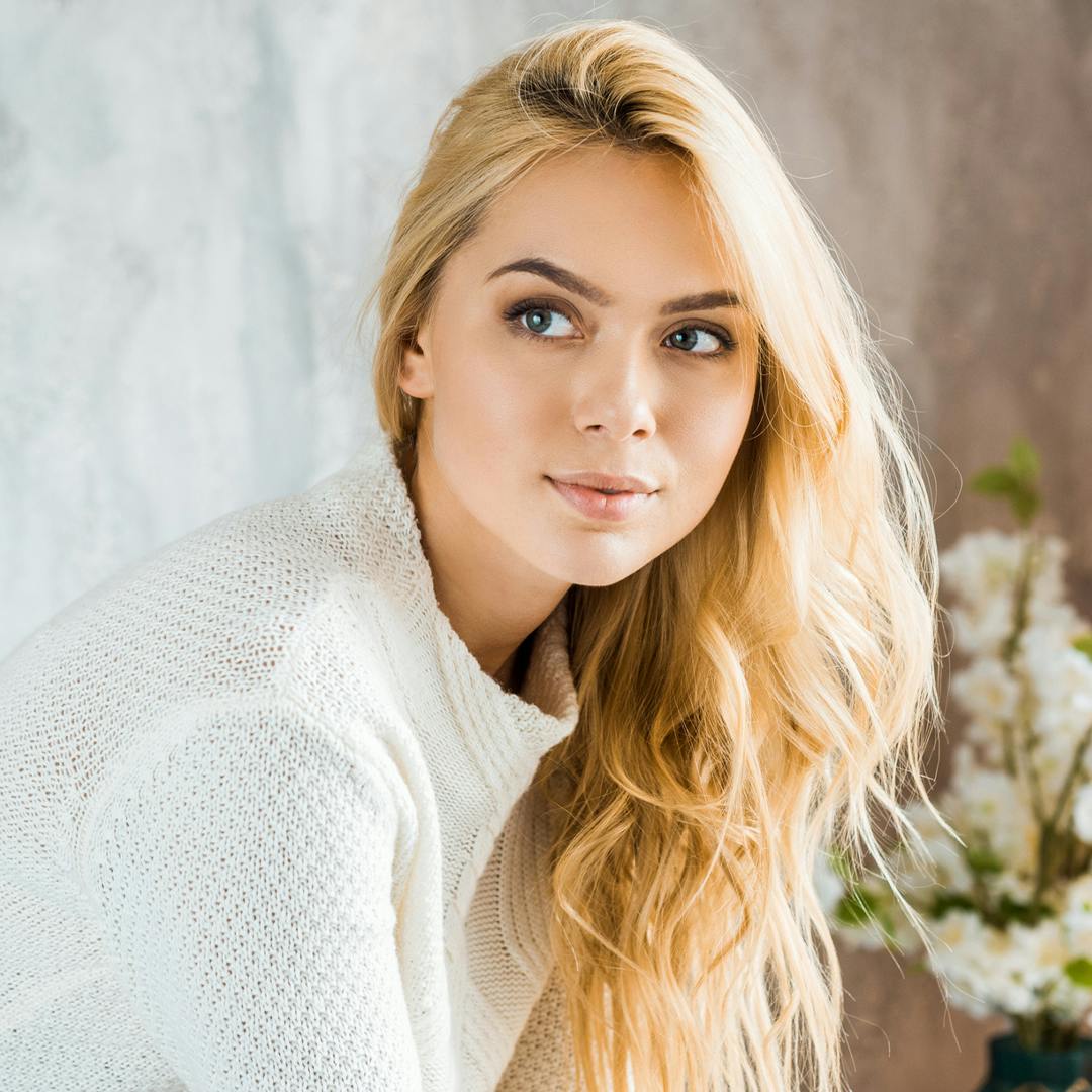 Woman wearing a white sweater