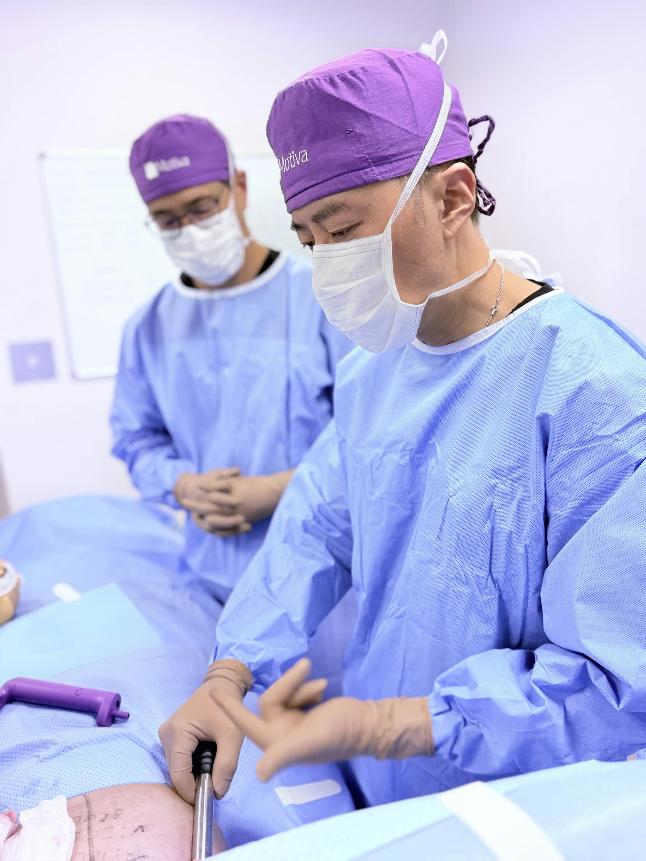 Dr. Tom Liu and Dr. Jerome Liu preforming breast augmentation procedure