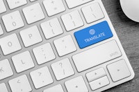 Wit toetsenbord met een blauwe knop 'translate'