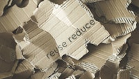 Stuk karton met de tekst Reuse Reduce