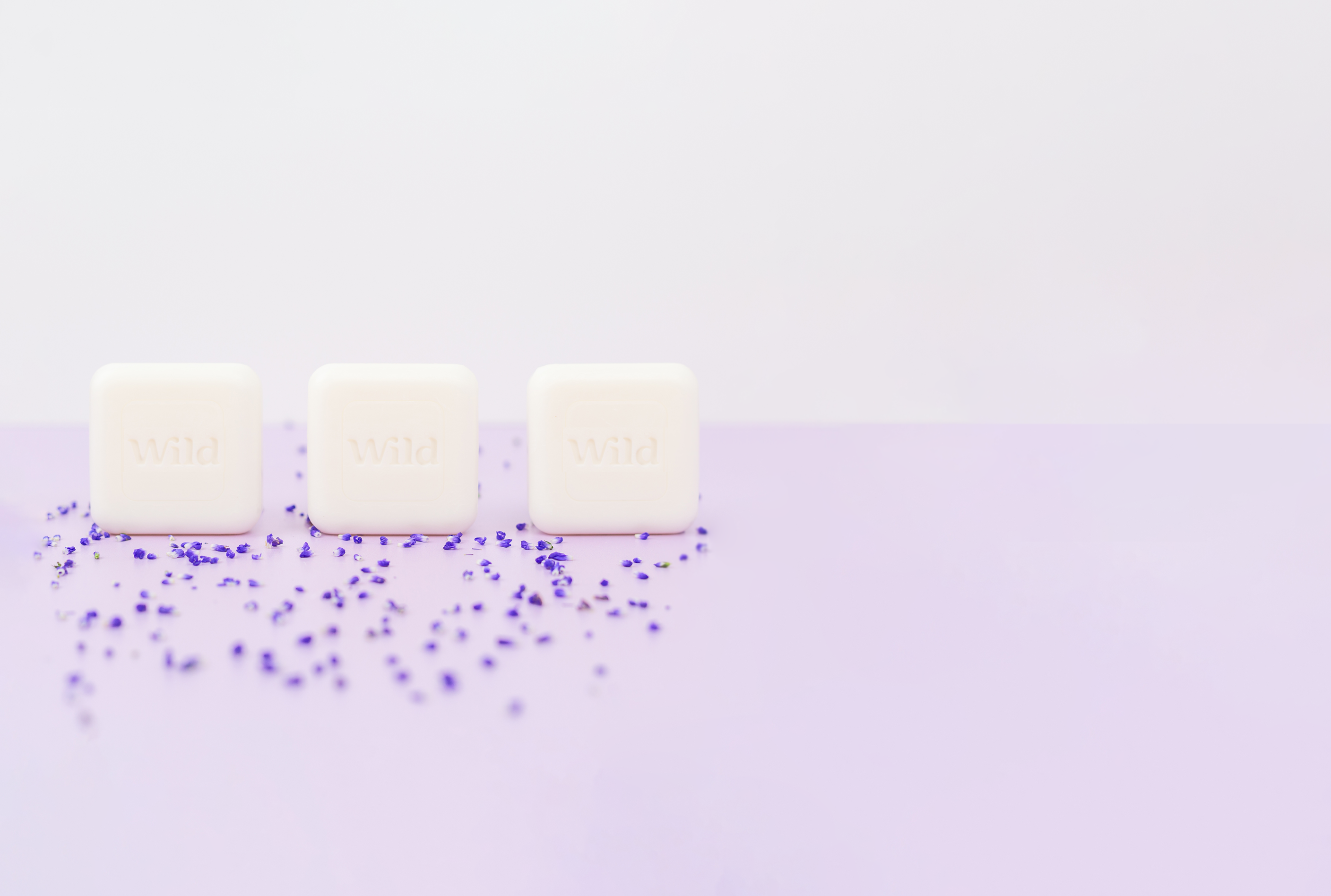 Trio of Wild soap surrounded by lavender leaves