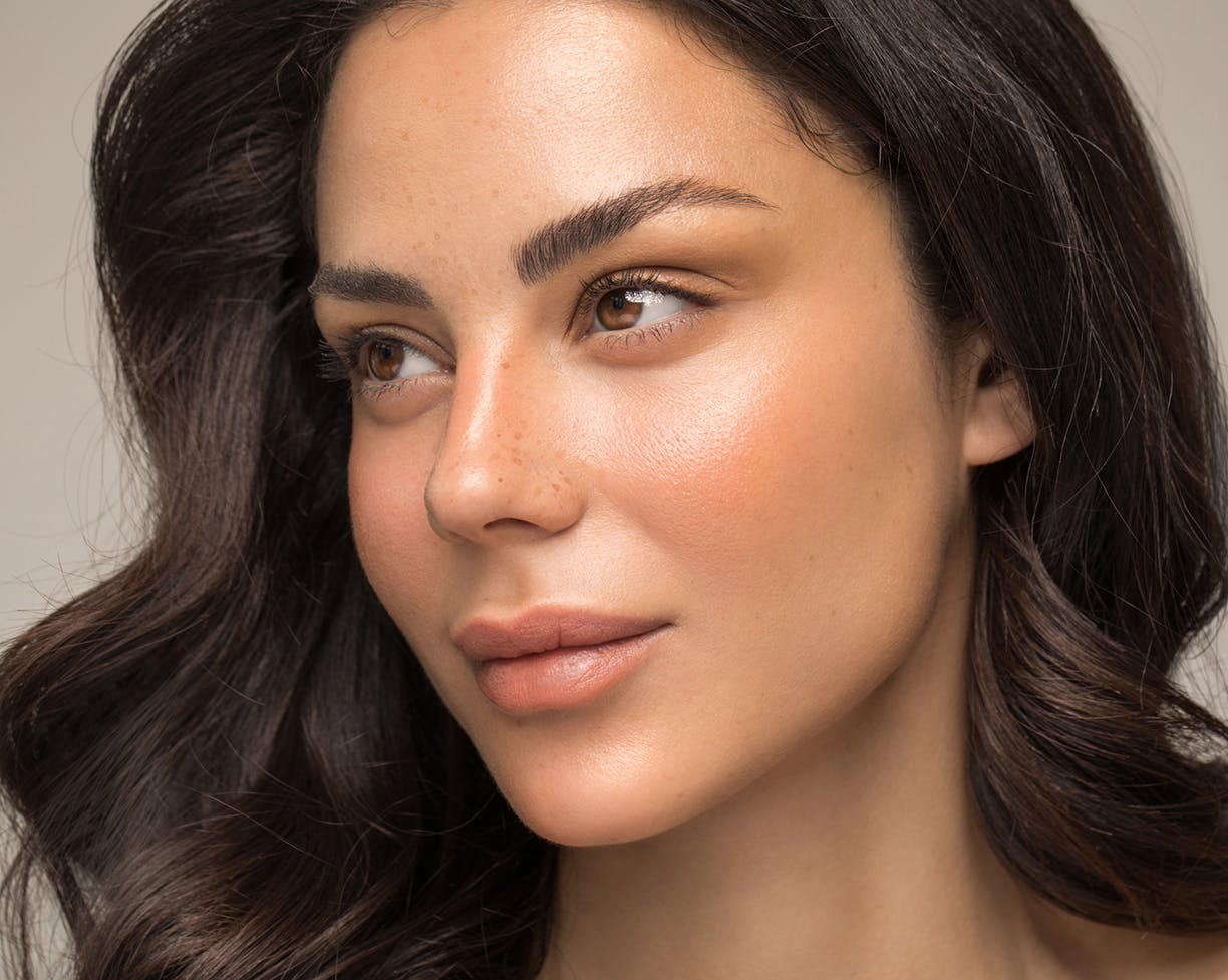 Close-up of a woman's face who is looking to side