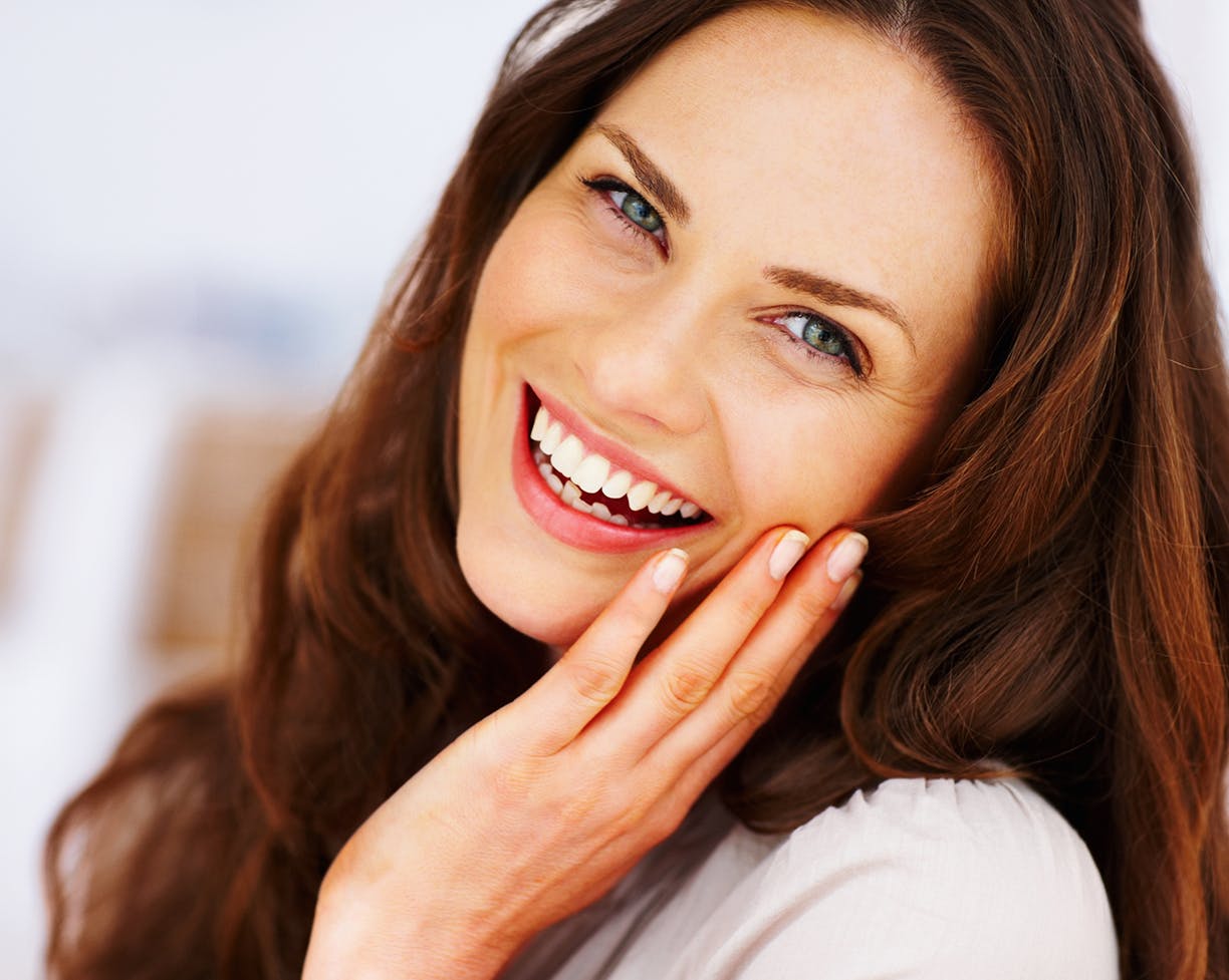 Woman with brown hair smiling