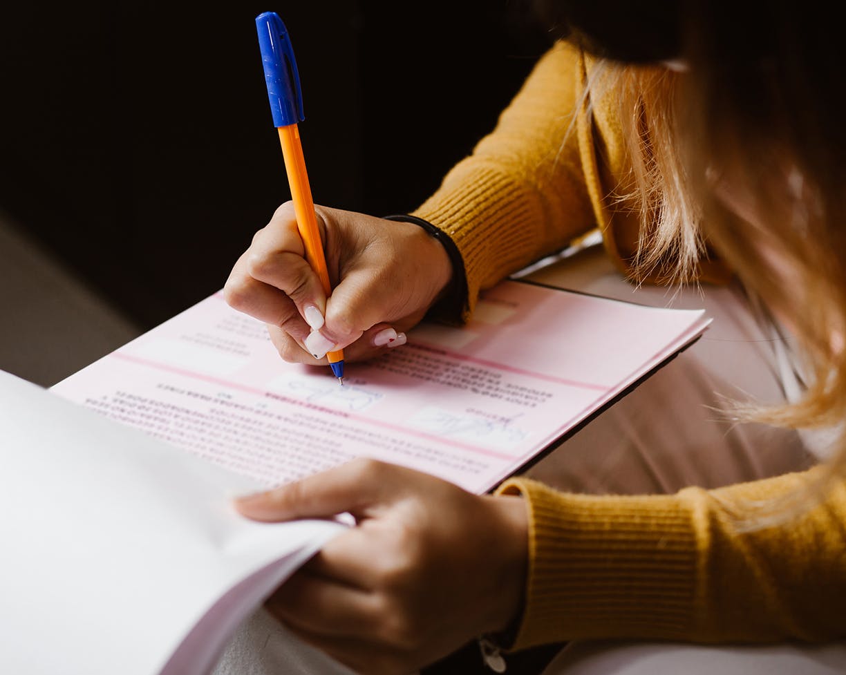 A woman filling out a document