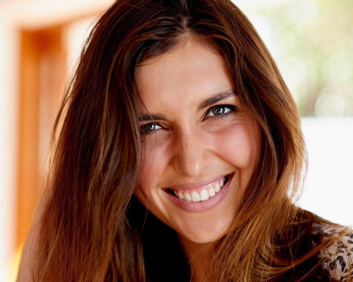 Woman with brown hair smiling