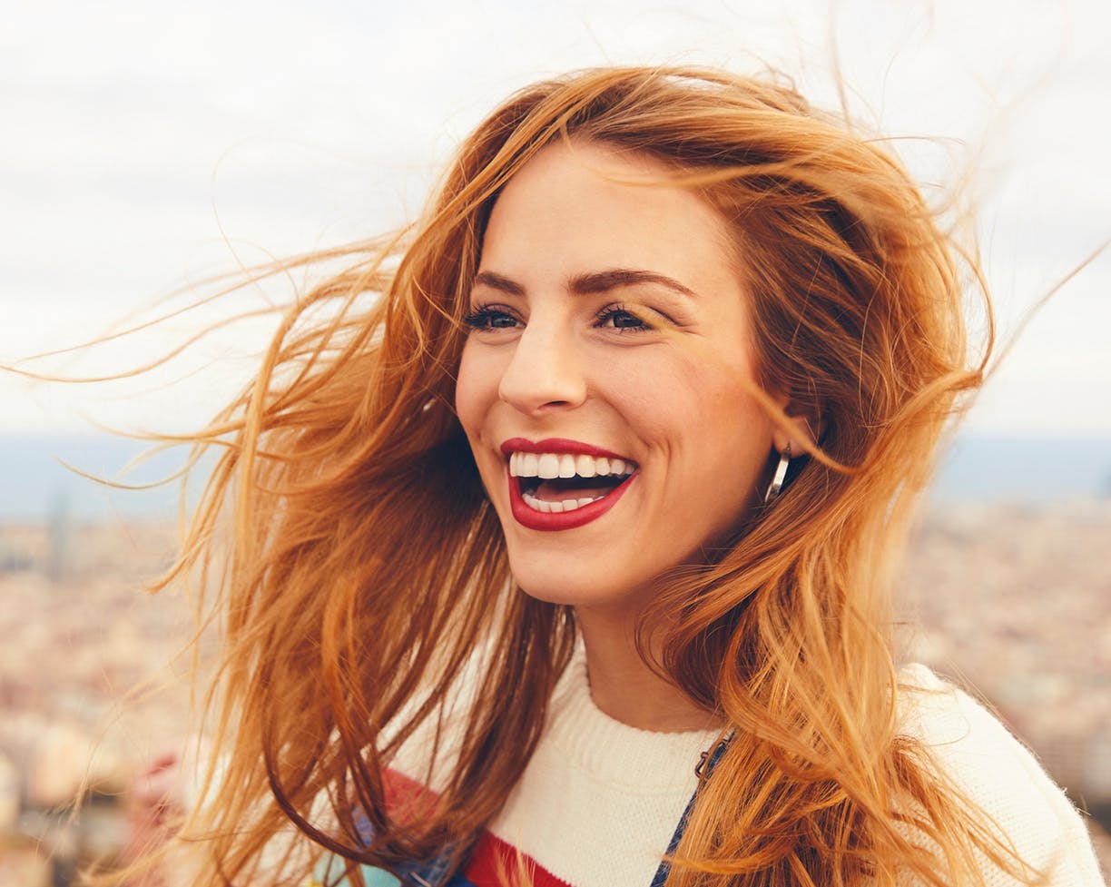 Red-headed woman laughing