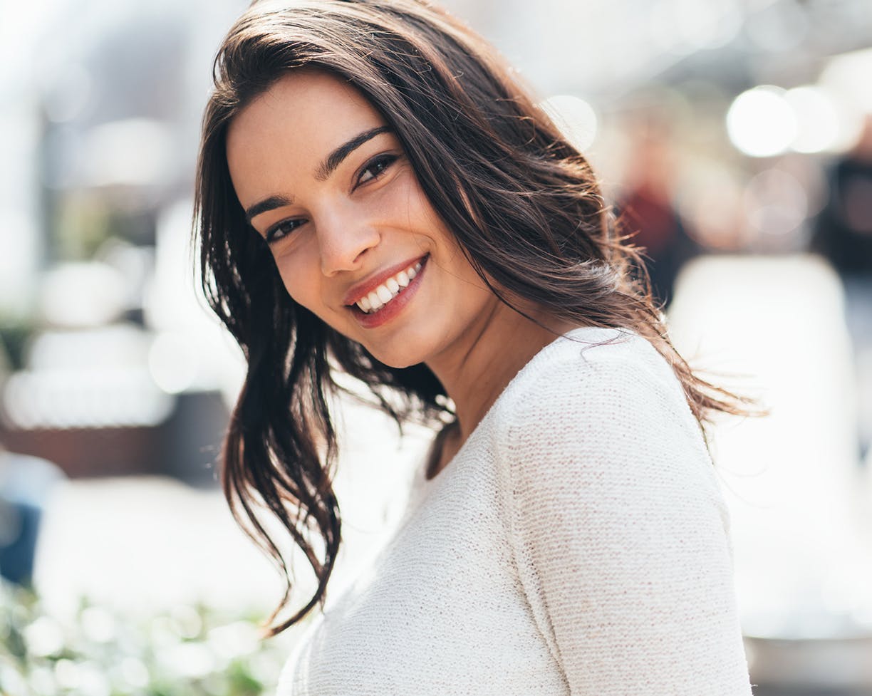 Brunette woman in white blouse
