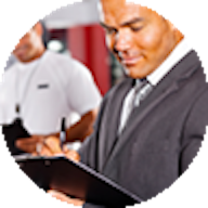 Executive Officer with clipboard in gym