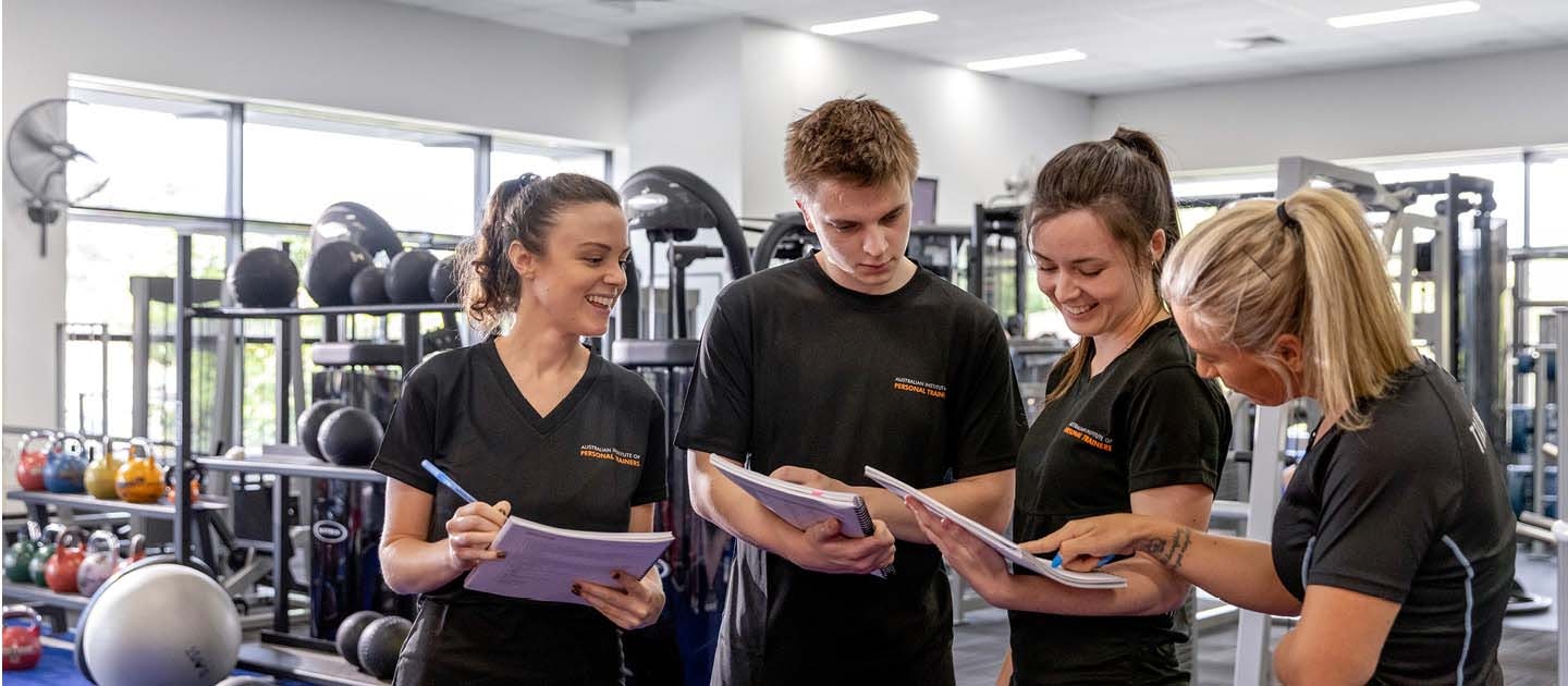 Group of students with trainer in a gym
