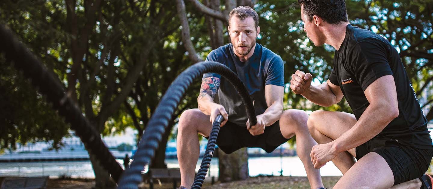 Males training with battle ropes