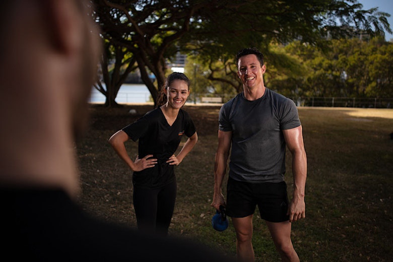 Clients with a trainer after a workout